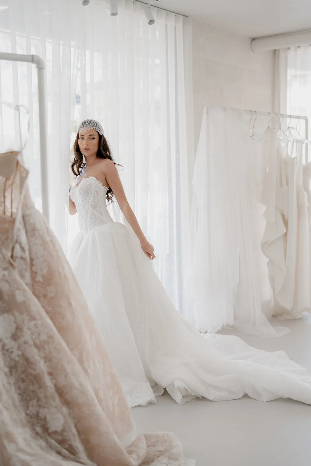 Adeline lace gown with a structured corset and voluminous skirt