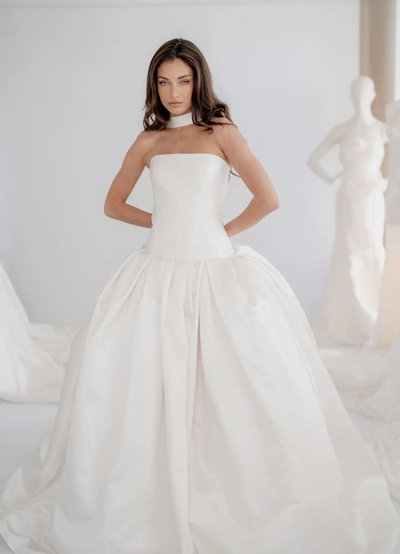 Valentina ivory strapless gown with a front slit and detachable sash neckline detail
